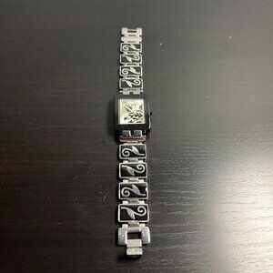 Swatch watch with black floral paterns